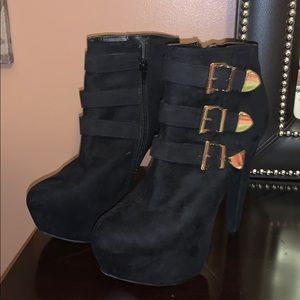 Black platform boots with gold  buckles